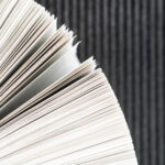 Close up book pages with black background 150x150