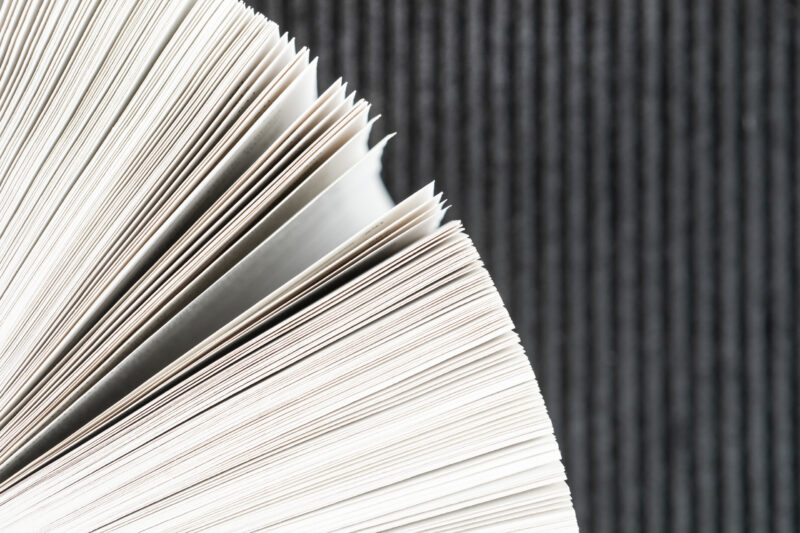 close-up-book-pages-with-black-background